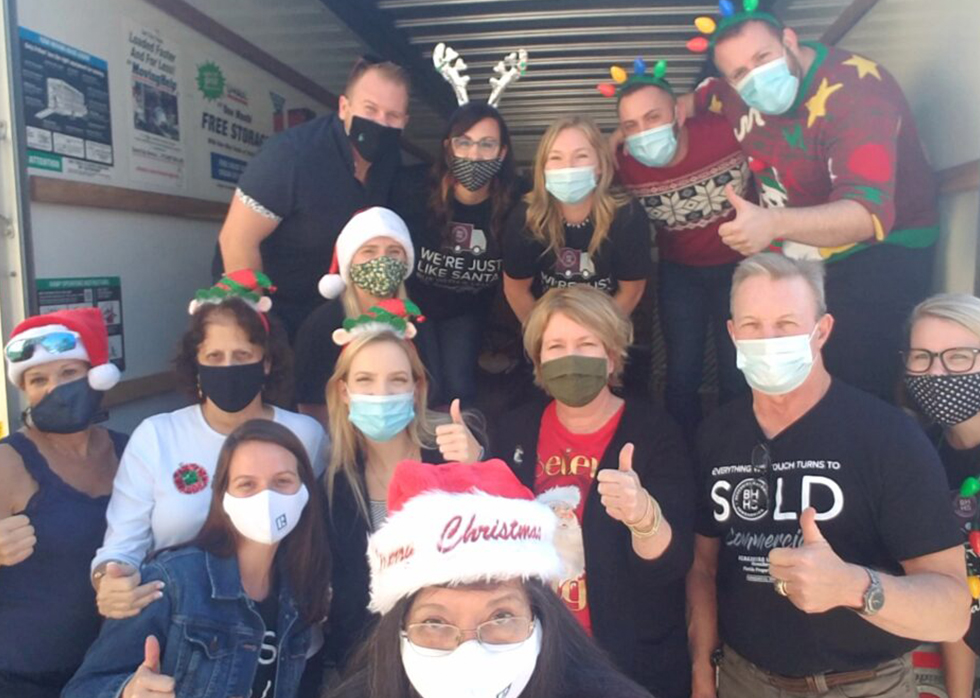 employees volunteering during cabernet sleigh